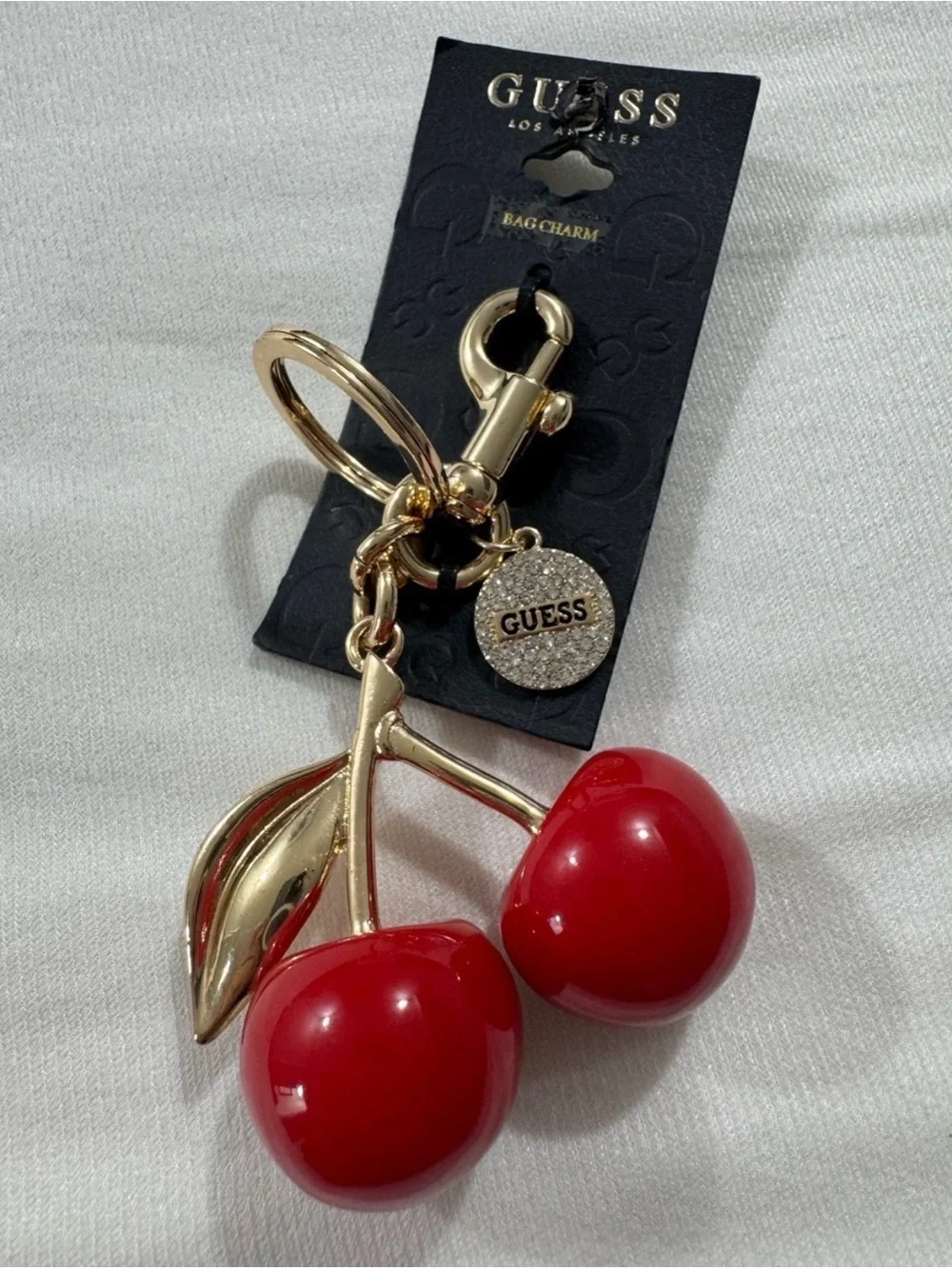 GUESS Cherry Bag Charm and Keychain in Gold Tone